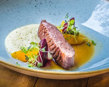 Pink duck breast with celeriac puree and orange