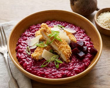 Beetroot risotto with panko-crusted fried chicken breast and Parmesan