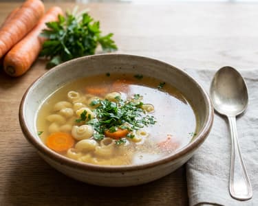 Guinea fowl broth with snail pasta
