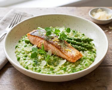 Green pea risotto with salmon and asparagus