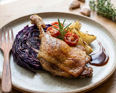 Confit Duck Leg with Cabbage Steak and Roasted Onion