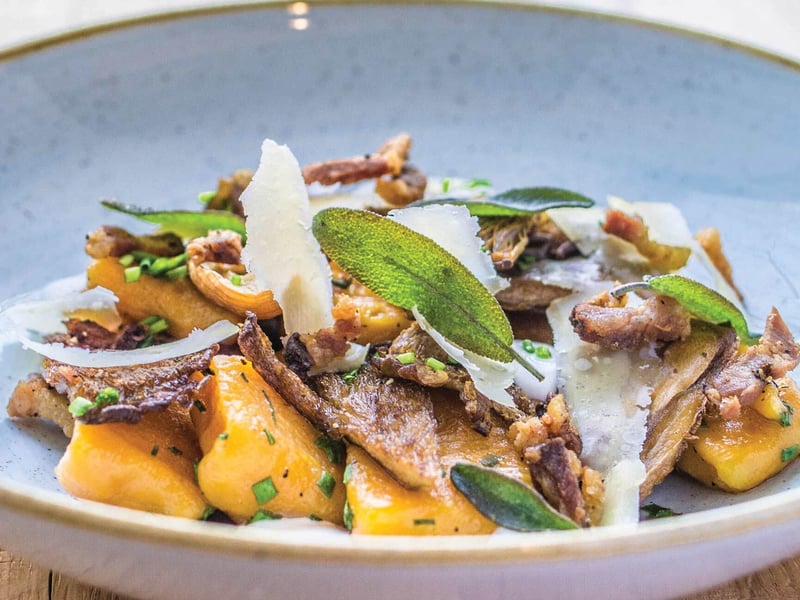 Sweet potato gnocchi with roasted parasol and oyster mushrooms, Parmesan, and sage