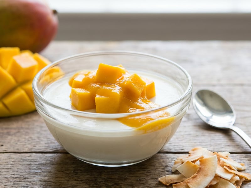 Coconut panna cotta with mango and coconut chips