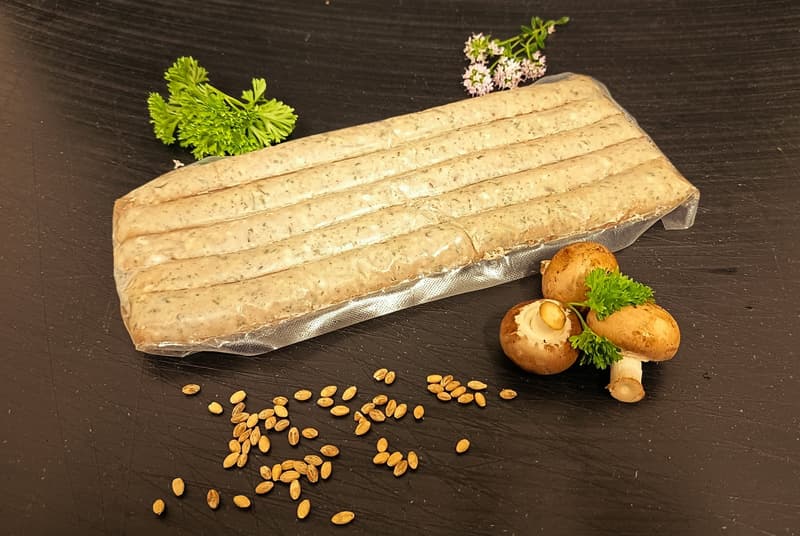 Grilled sausage from duck with boletus and barley pearl sous vide