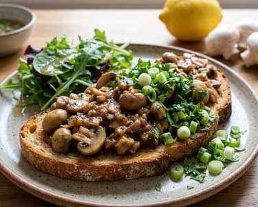 Garlic mushroom ragout on sourdough toast with fresh salad