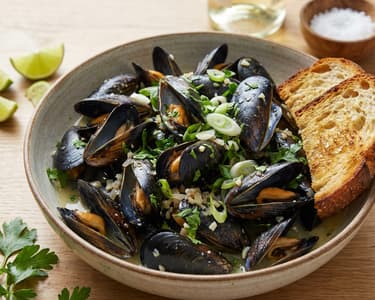 Mussels steamed in white wine butter sauce with sourdough toast