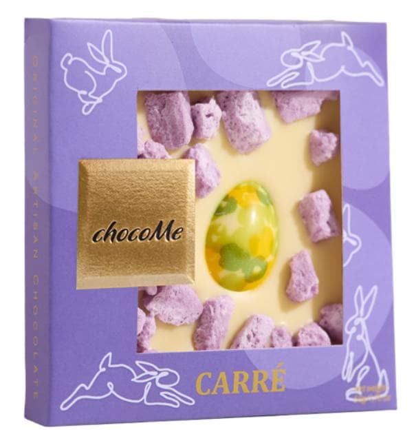 White chocolate with golden coloured chocolate egg, with crystallized violet petal